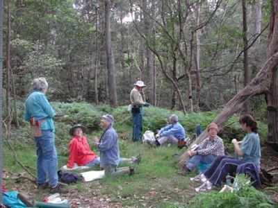 Bushcare volunteers sitting together during a break